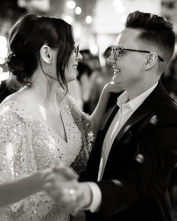 Had to be You Weddings 4 - I do I do Gippsland Smiling couple dancing closely at a formal event, she in a sequined dress and he in a suit.