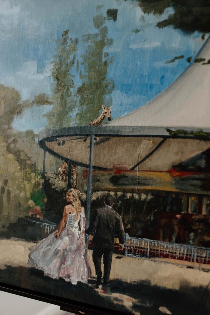 Kewish-52 | I do I do Gippsland Bride in a white wedding dress walking beside a man in a dark suit at an outdoor venue, near a railing.